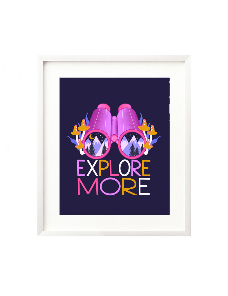 A framed art print - the illustration is of a pair of binoculars with a mountain scene at night inside the lenses. There are purple mountains, whimsical tree silhouettes, and it is illuminated by a crescent moon and twinkling stars. Surrounding the binoculars are lively mushrooms and squiggly grass and hand lettered beneath is the message "Explore More"