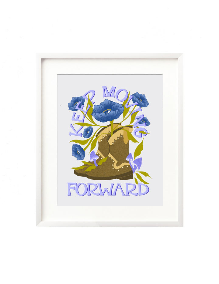A framed art print - the illustration is of a brown cowgirl boot, surrounded by vibrant purple and blue mushrooms and florals. Hand lettered is the message "Keep moving forward" in a groovy, retro inspired western style.